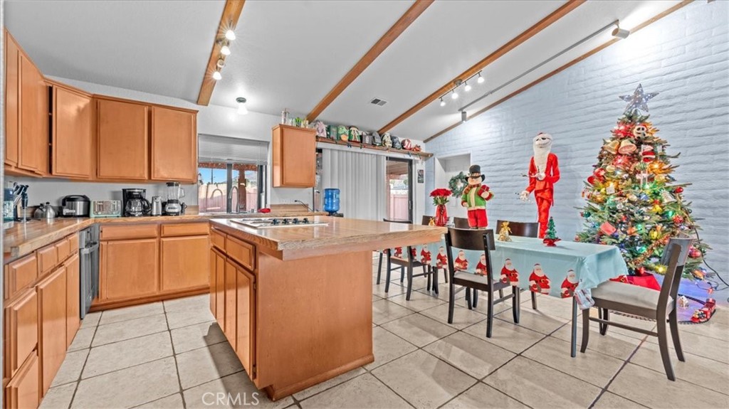 16043 St Timothy Road Apple Valley, CA 92307 - Photo 17 of 48 a group of people sitting in a kitchen