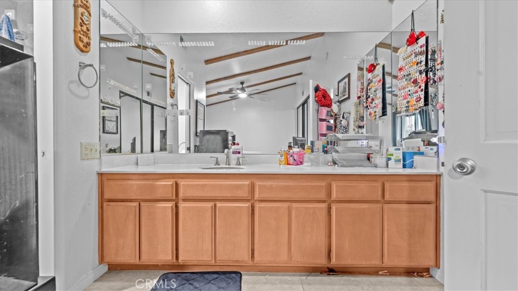 16043 St Timothy Road Apple Valley, CA 92307 - Photo 21 of 48 a bathroom with a sink and a mirror