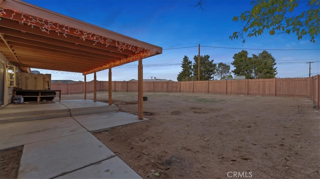 16043 St Timothy Road Apple Valley, CA 92307 - Photo 26 of 48 a view of a backyard