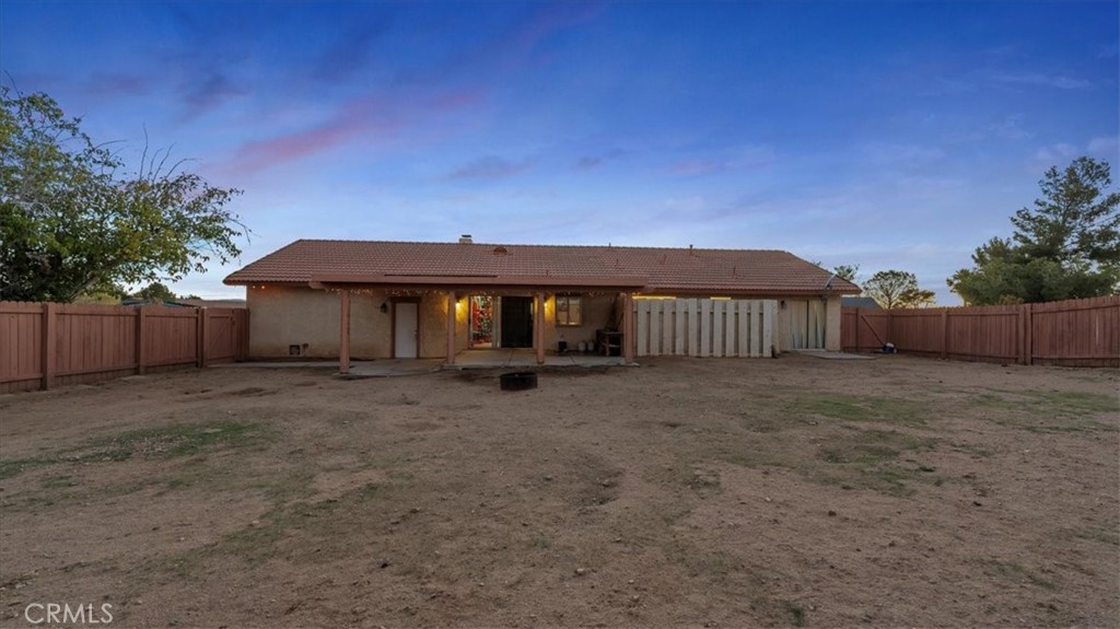 16043 St Timothy Road Apple Valley, CA 92307 - Photo 31 of 48 a view of a house with a yard