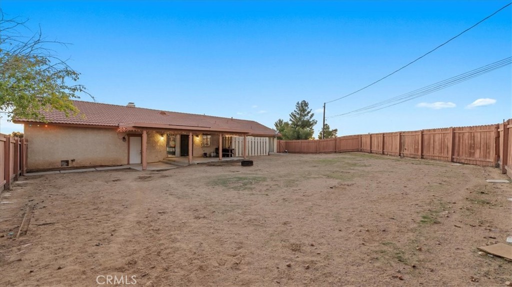 16043 St Timothy Road Apple Valley, CA 92307 - Photo 32 of 48 a front view of a house with a yard