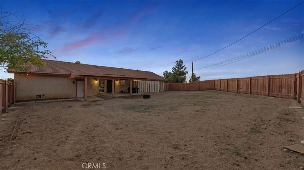 16043 St Timothy Road Apple Valley, CA 92307 - Photo 33 of 48 a front view of house with a garden