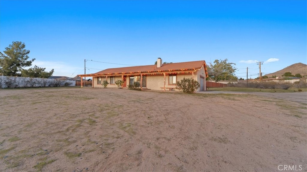 16043 St Timothy Road Apple Valley, CA 92307 - Photo 4 of 48 a big house with a yard