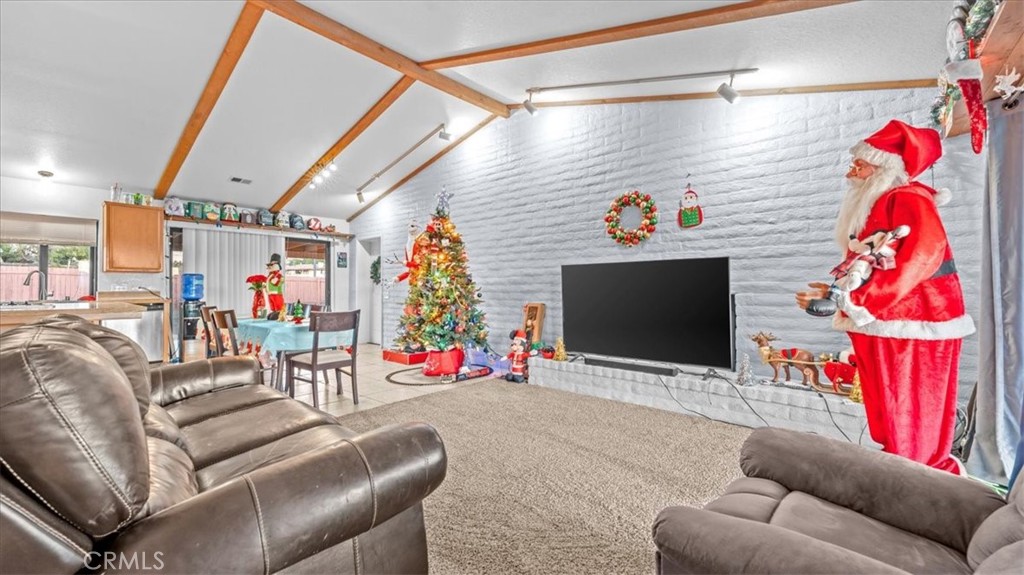 16043 St Timothy Road Apple Valley, CA 92307 - Photo 7 of 48 a living room with furniture and a flat screen tv