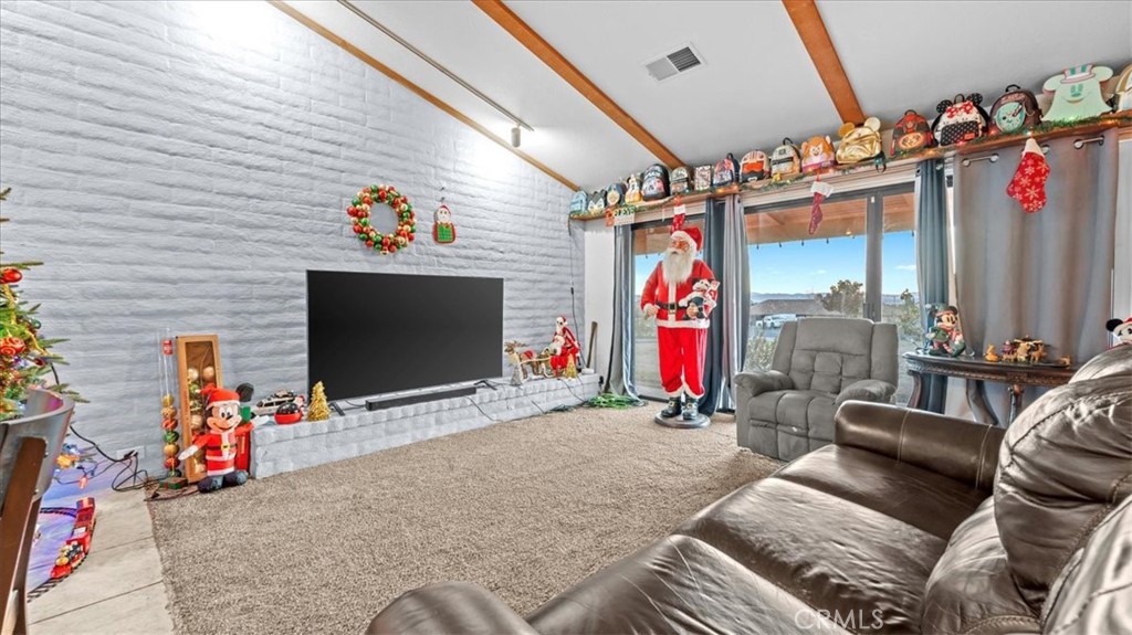 16043 St Timothy Road Apple Valley, CA 92307 - Photo 8 of 48 a view of a livingroom with furniture and toys