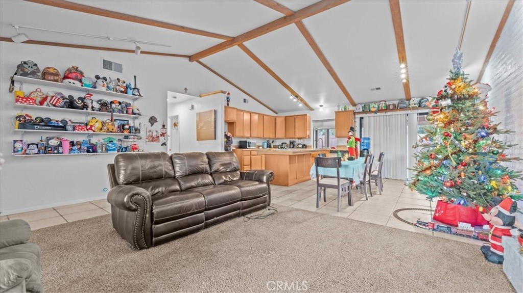 16043 St Timothy Road Apple Valley, CA 92307 - Photo 9 of 48 a living room with furniture and a potted plant