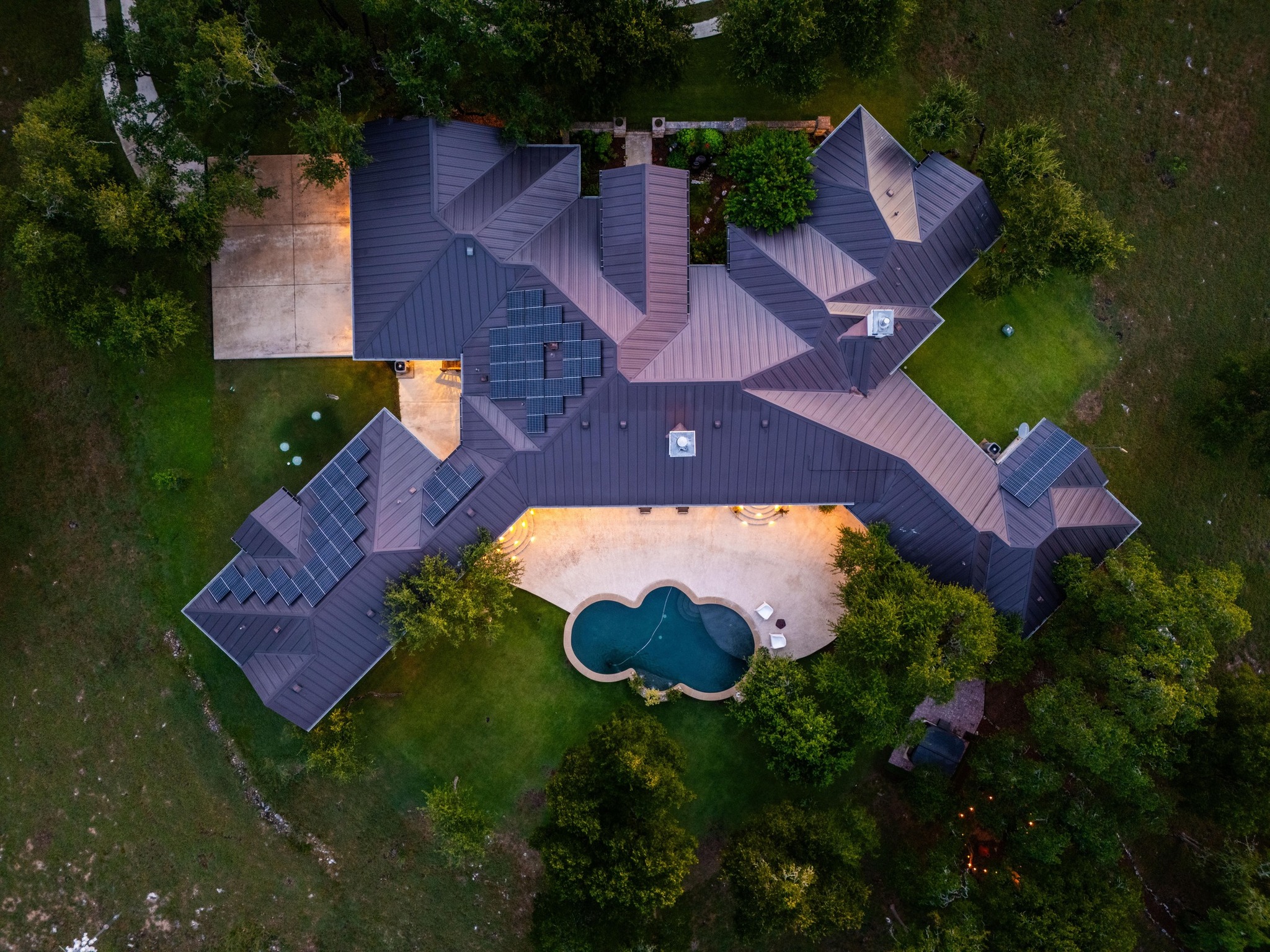 401 Trail Ridge Road Wimberley, TX 78676 - Photo 33 of 34 Aerial view of property and surrounding area with a pool area