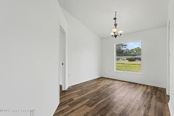 a kitchen with white cabinets and a sink