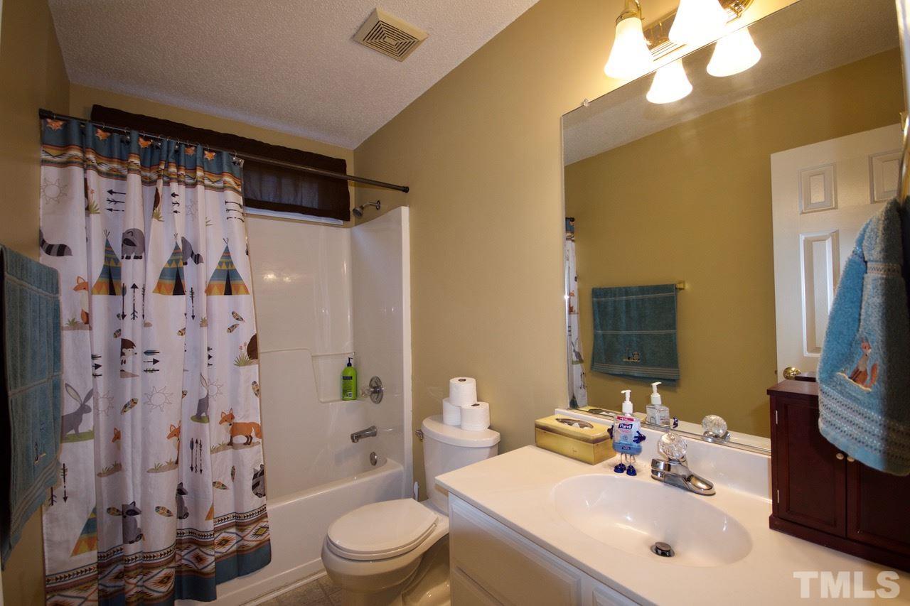128 Forest Ridge Drive Willow Spring, NC 27592 - Photo 18 of 25 a bathroom with a sink toilet and shower