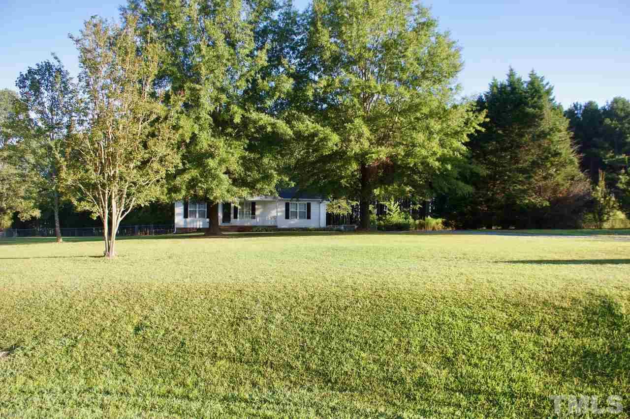 128 Forest Ridge Drive Willow Spring, NC 27592 - Photo 22 of 25 a view of a field with trees in front of it