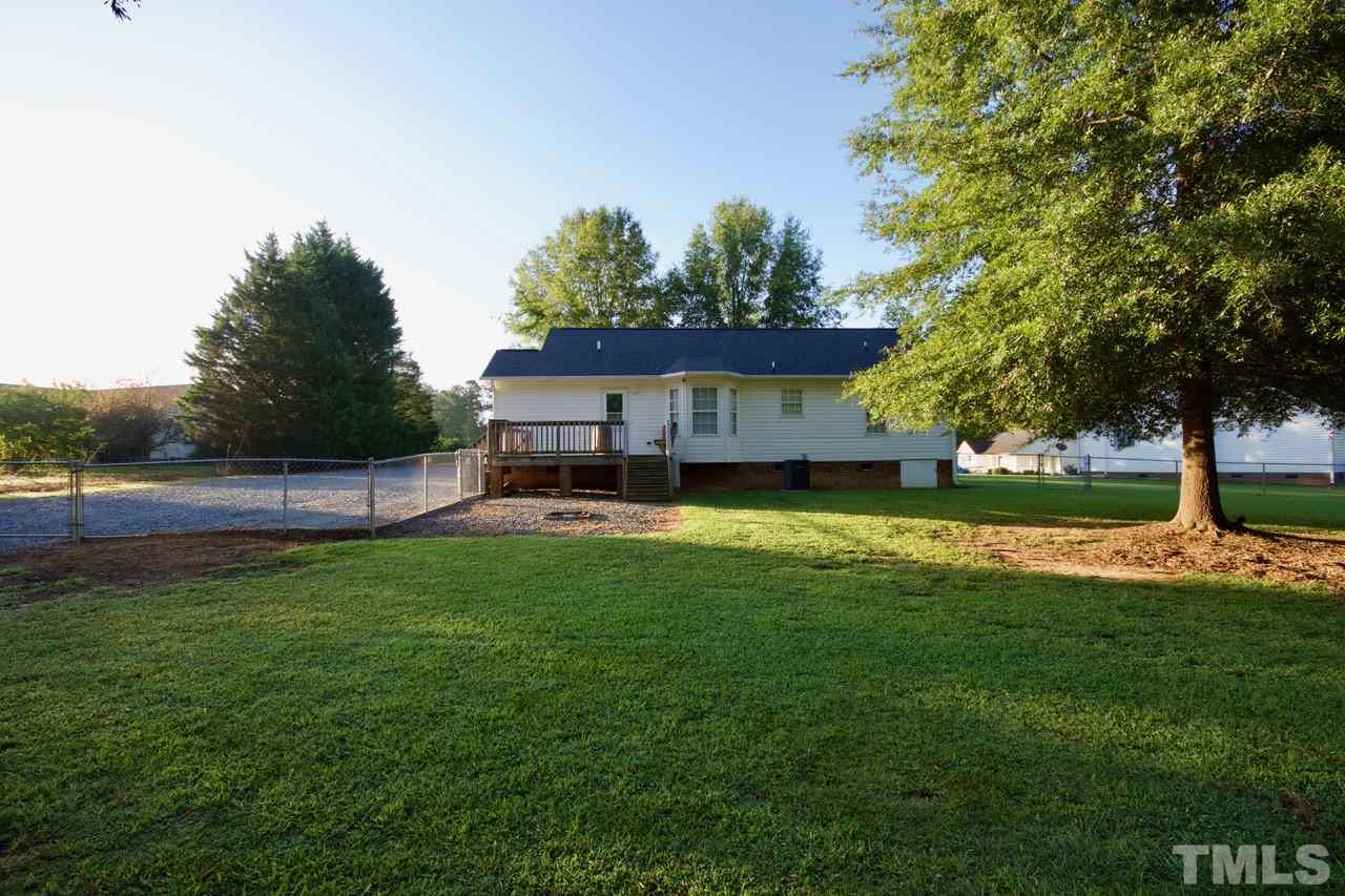 128 Forest Ridge Drive Willow Spring, NC 27592 - Photo 25 of 25 a view of a house with backyard and garden