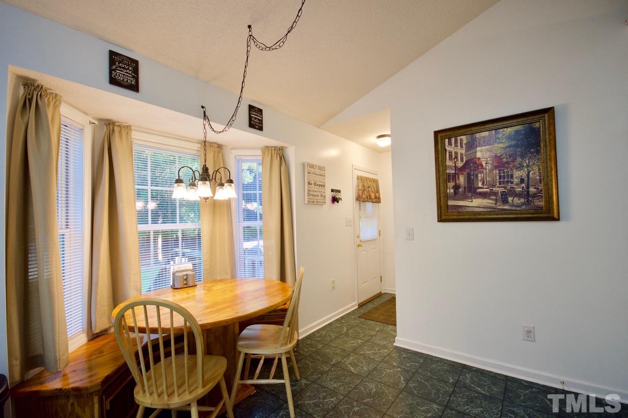 128 Forest Ridge Drive Willow Spring, NC 27592 - Photo 10 of 25 a view of a dining room with furniture window and wooden floor
