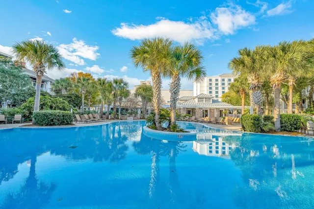 a view of a swimming pool with an outdoor seating