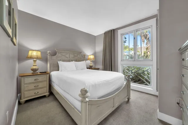 a bed room with a bed and a window