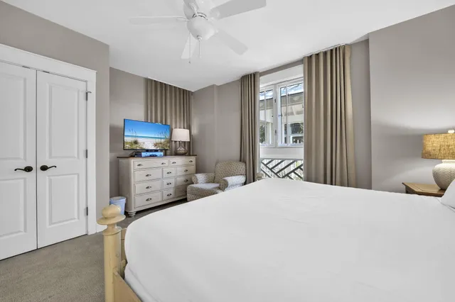 a bedroom with furniture and a window