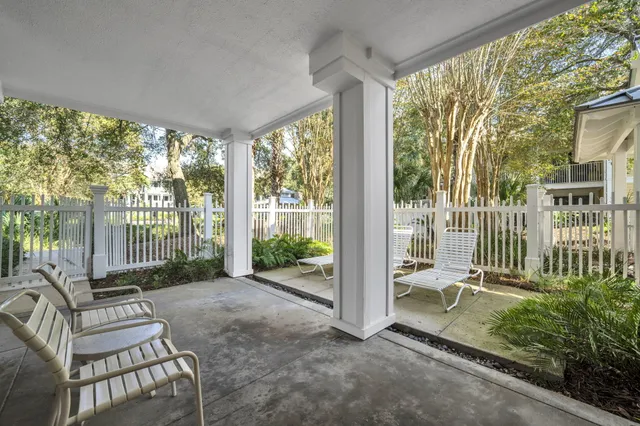 a living room with large trees and a large window