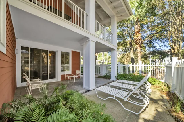 a view of patio with a chairs and table in a patio
