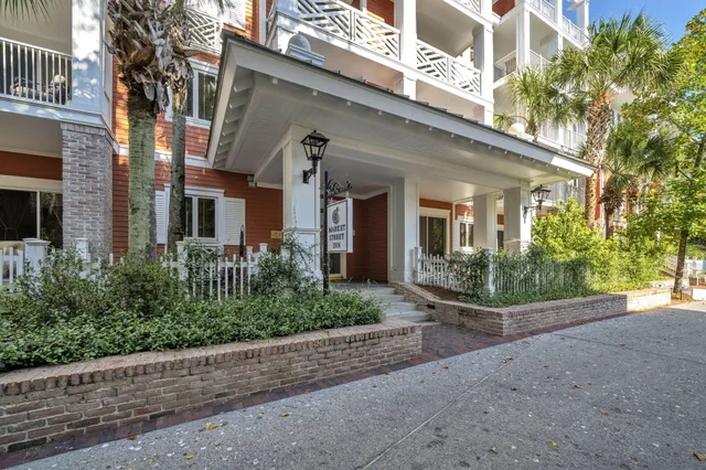 a view of a building with potted plants