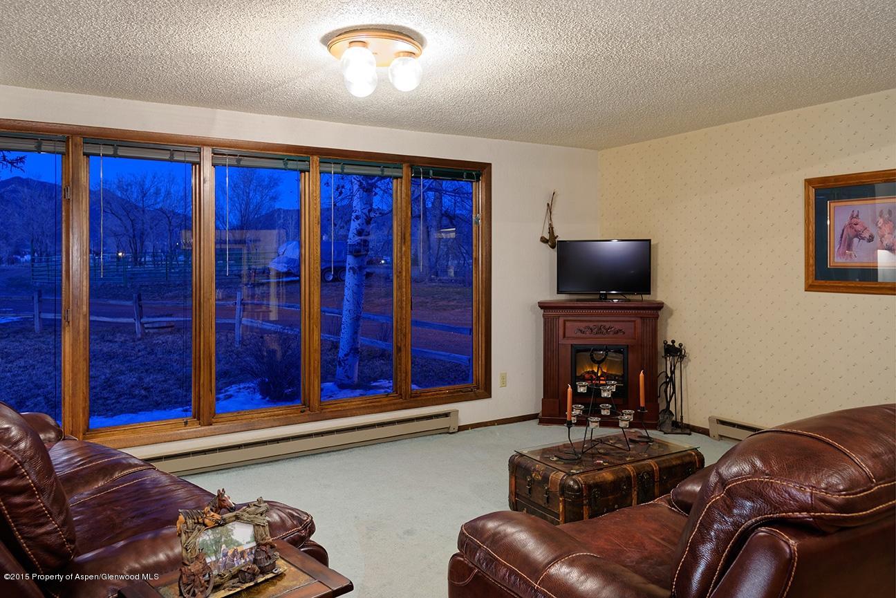 268 Fox Run Road Rifle, CO 81650 - Photo 17 of 36 a living room with furniture and a fireplace