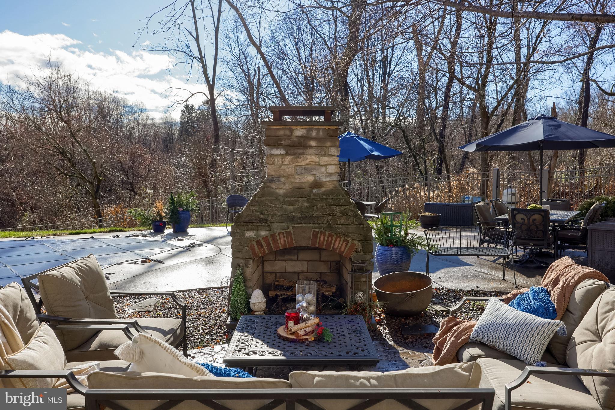 471 Shenks Ferry Road Conestoga, PA 17516 - Photo 12 of 105 a outdoor space with patio the couches and a fireplace