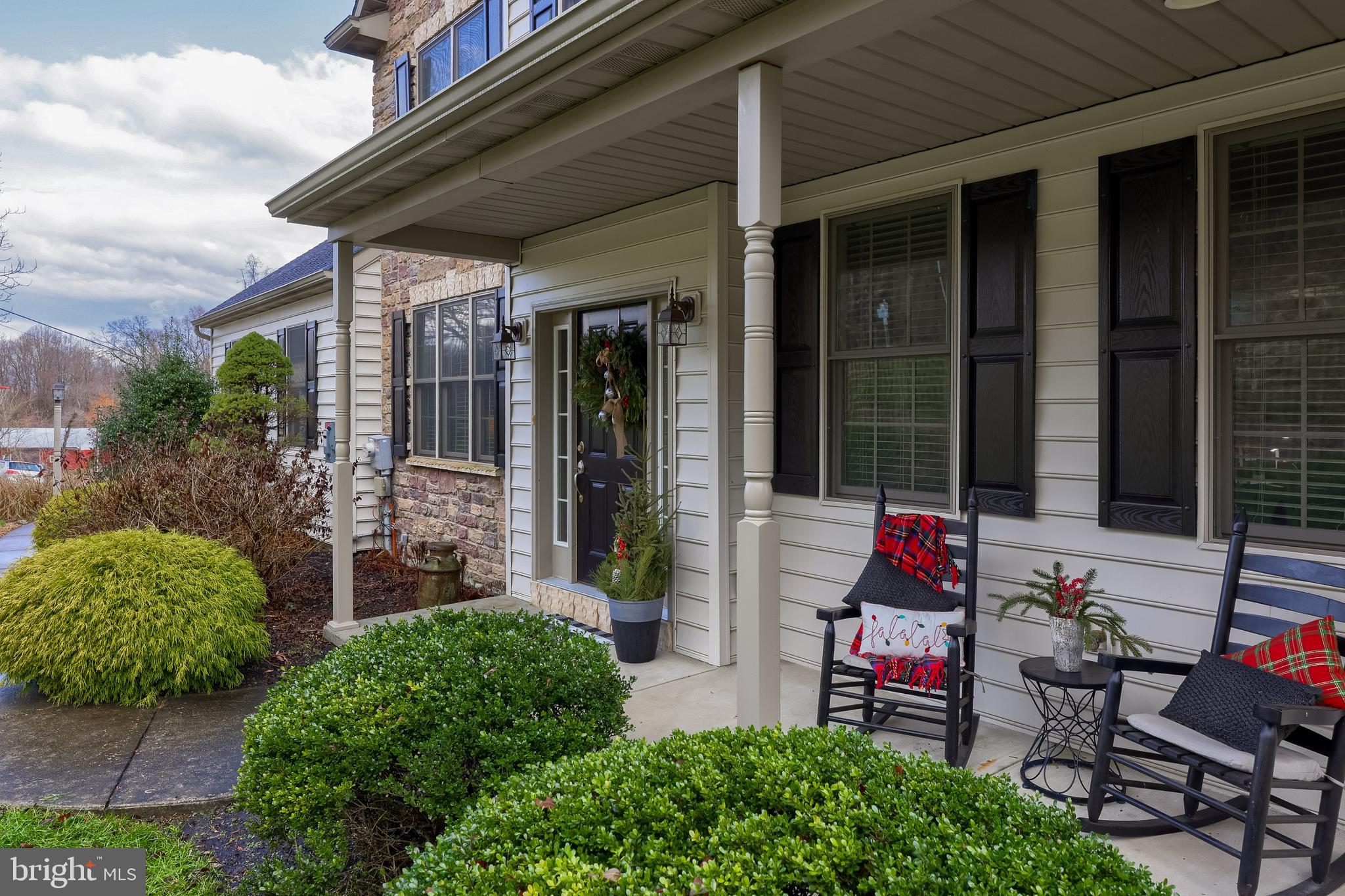 471 Shenks Ferry Road Conestoga, PA 17516 - Photo 14 of 105 a chair and table in front of a house