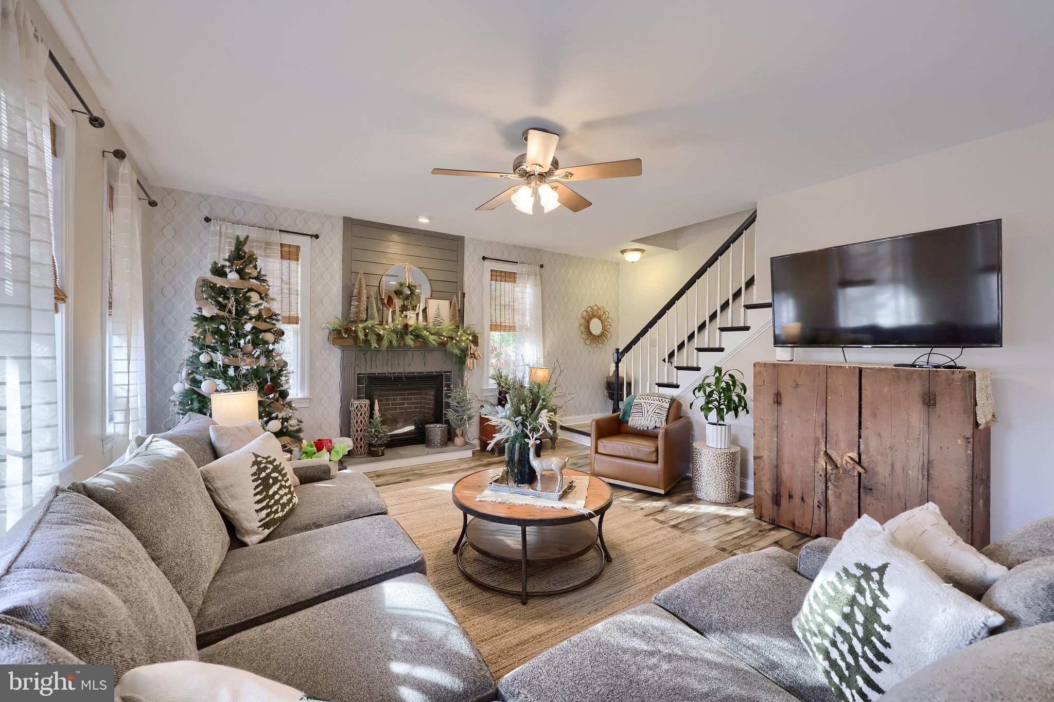 471 Shenks Ferry Road Conestoga, PA 17516 - Photo 17 of 105 a living room with furniture a fireplace and a flat screen tv