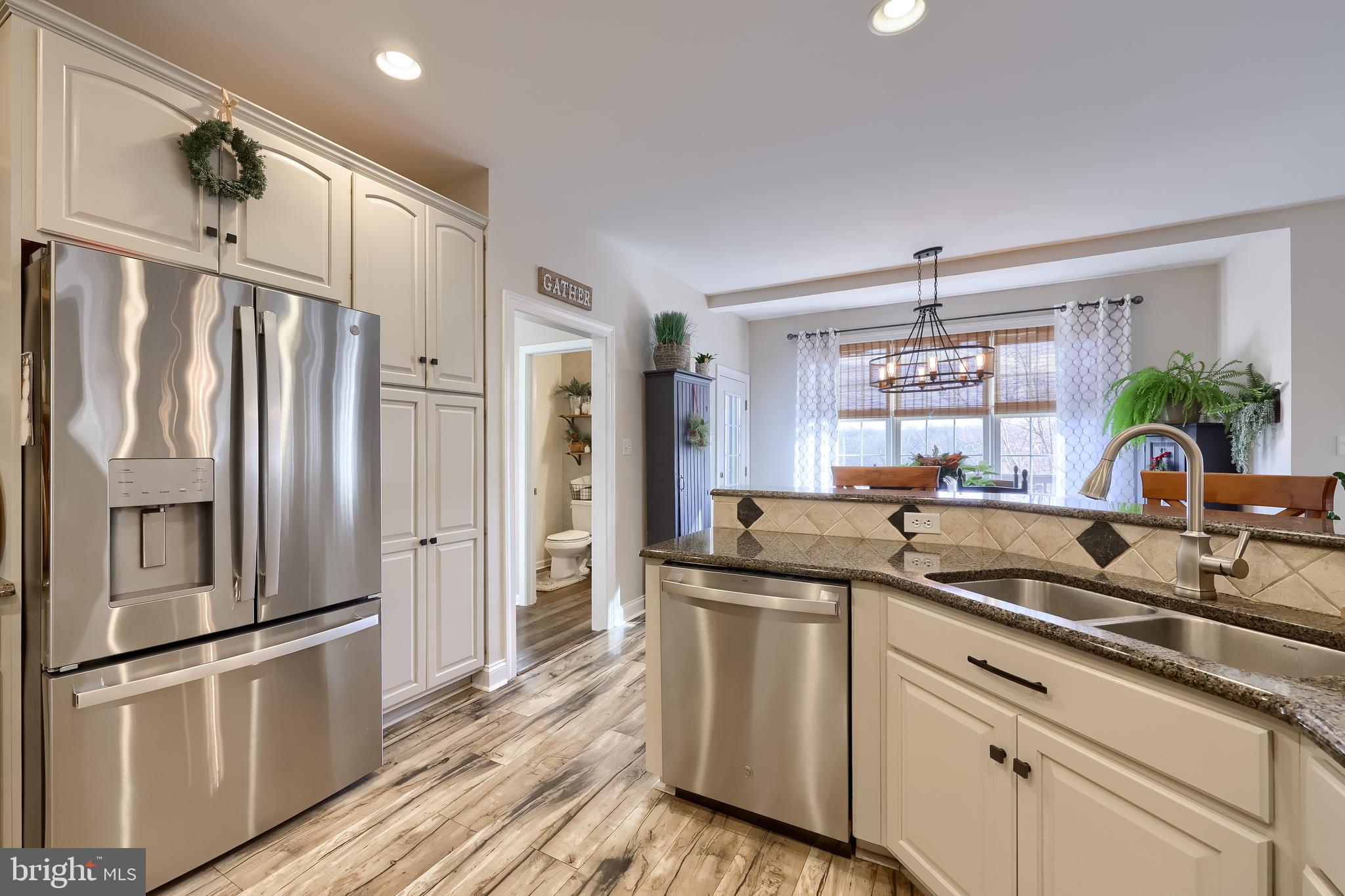 471 Shenks Ferry Road Conestoga, PA 17516 - Photo 27 of 105 a kitchen with stainless steel appliances granite countertop a refrigerator a sink and white cabinets