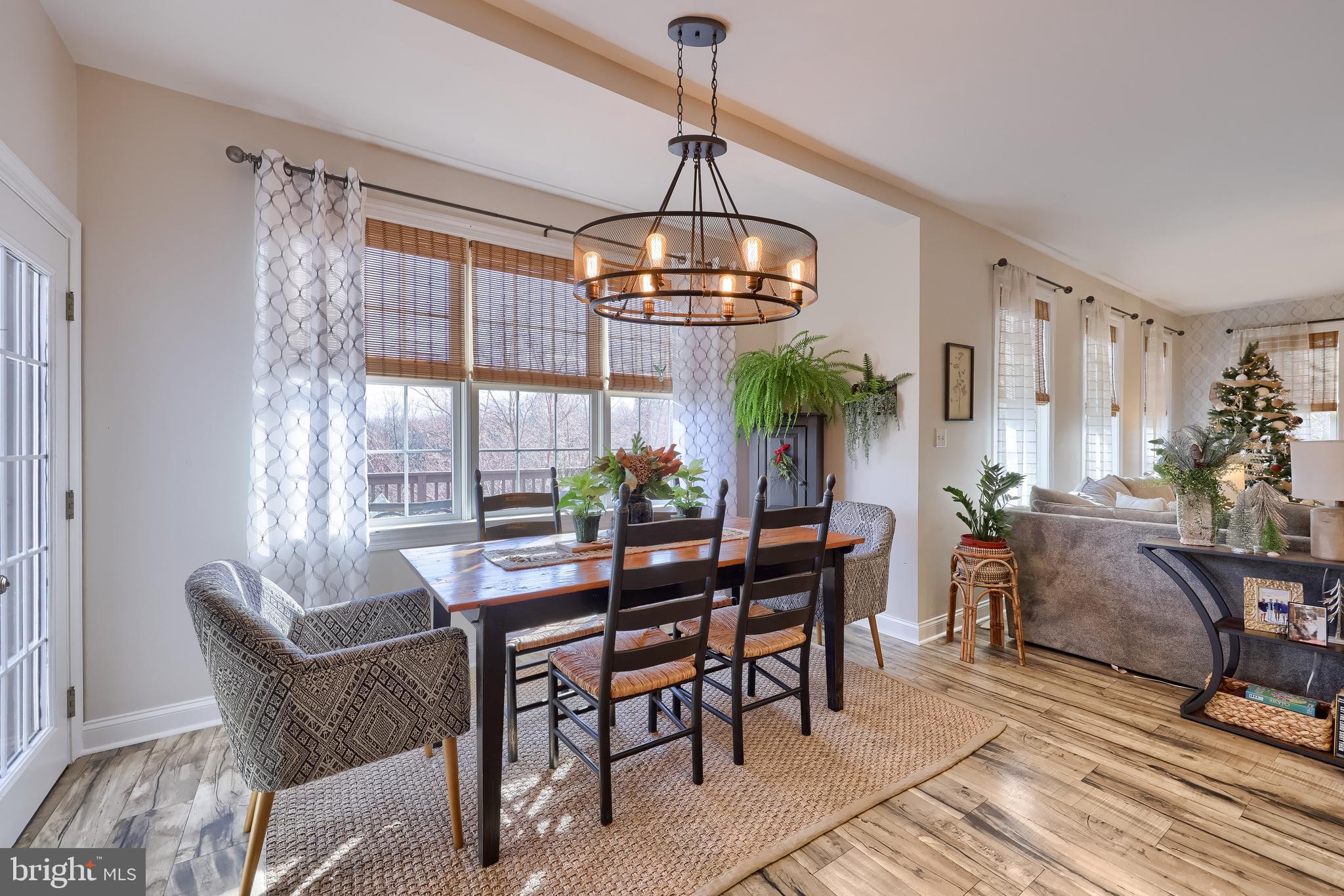 471 Shenks Ferry Road Conestoga, PA 17516 - Photo 31 of 105 a dining room with furniture a chandelier and wooden floor