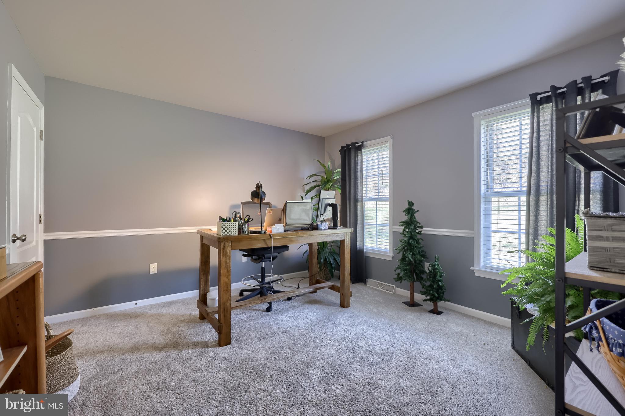 471 Shenks Ferry Road Conestoga, PA 17516 - Photo 54 of 105 a view of a workspace with furniture and a potted plant