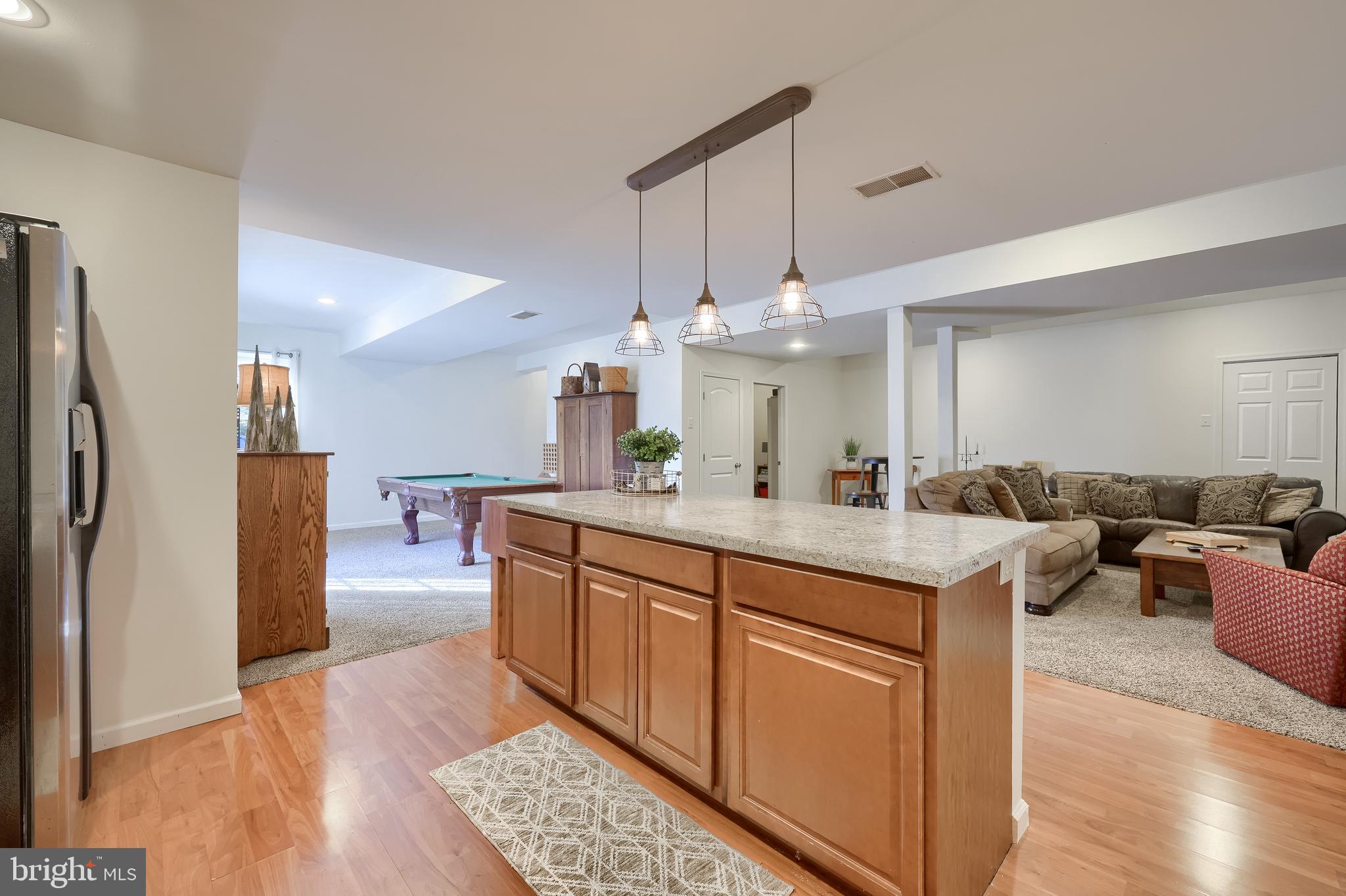 471 Shenks Ferry Road Conestoga, PA 17516 - Photo 62 of 105 a kitchen with stainless steel appliances a sink cabinets and wooden floor