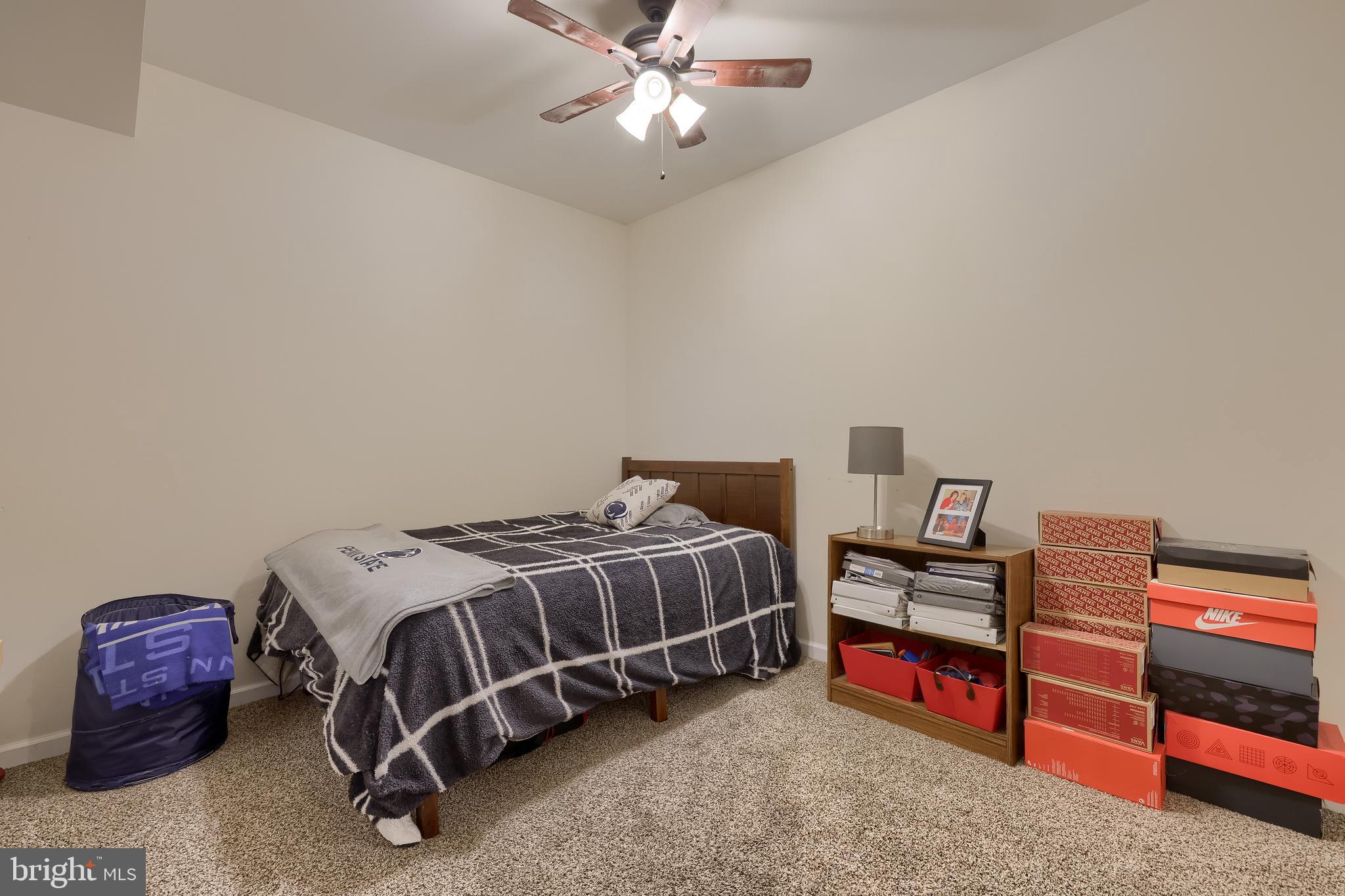 471 Shenks Ferry Road Conestoga, PA 17516 - Photo 74 of 105 a bedroom with a bed and a chandelier