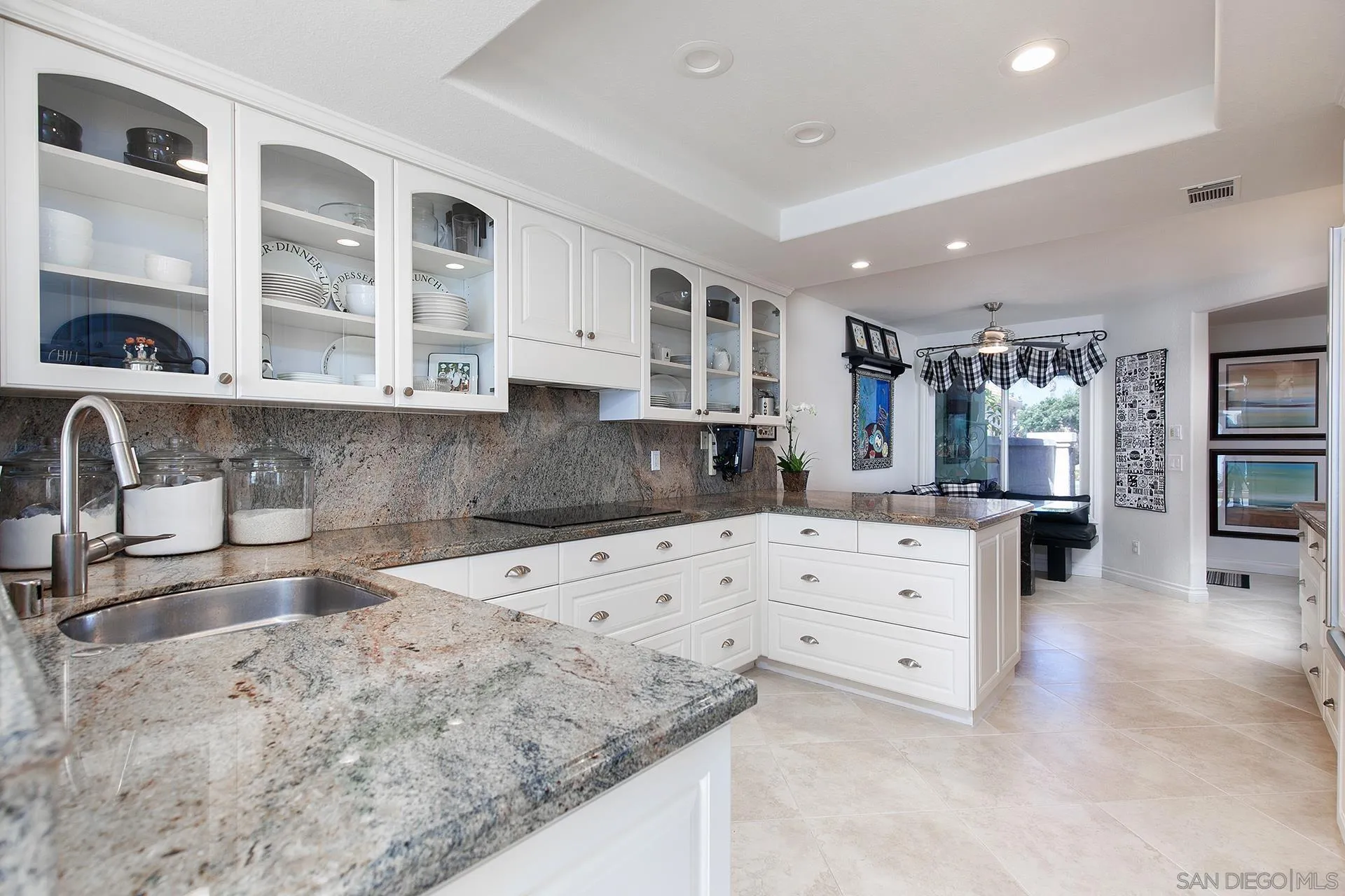 5 Aruba Bend Coronado, CA 92118 - Photo 16 of 40 a kitchen with granite countertop a sink and cabinets