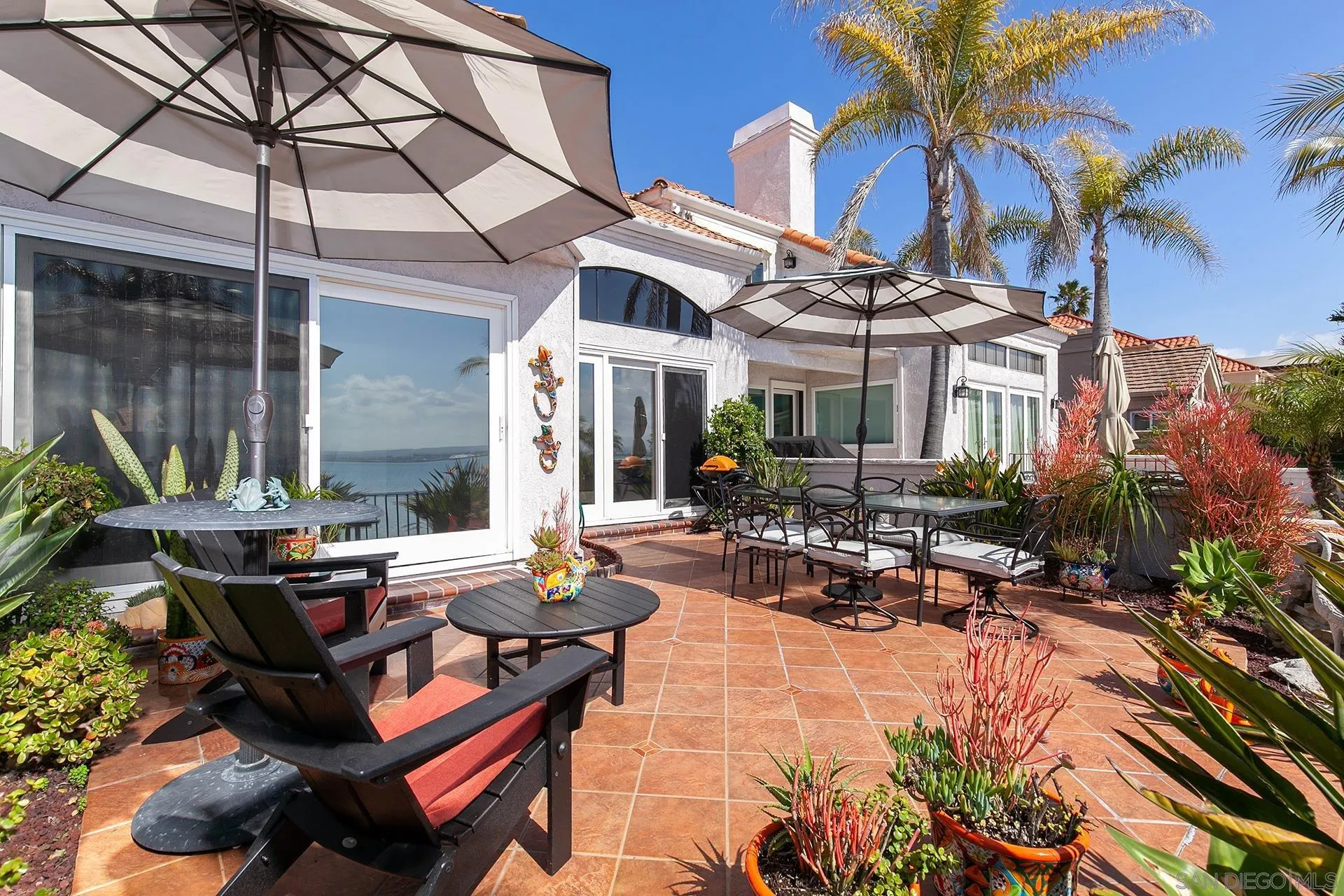 5 Aruba Bend Coronado, CA 92118 - Photo 25 of 40 a view of a patio with chairs and tables in the patio
