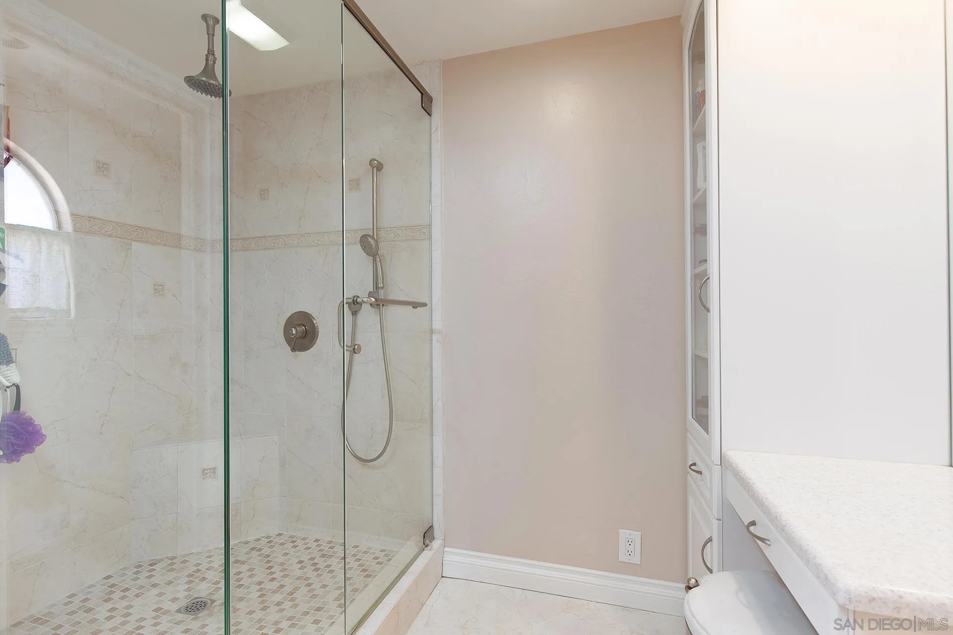 5 Aruba Bend Coronado, CA 92118 - Photo 36 of 40 a bathroom with a glass shower door