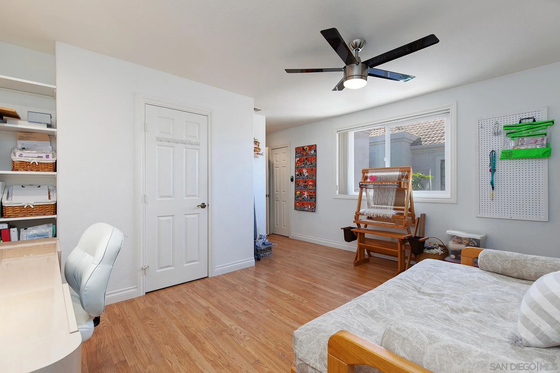 5 Aruba Bend Coronado, CA 92118 - Photo 37 of 40 a bedroom with a bed and wooden floor