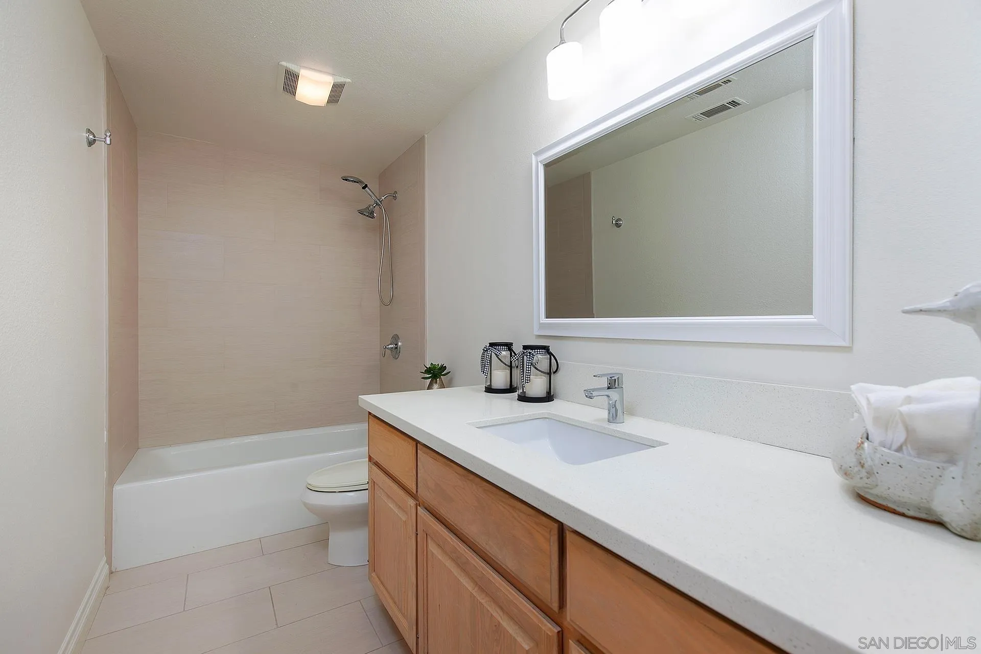 5 Aruba Bend Coronado, CA 92118 - Photo 38 of 40 a bathroom with a sink a toilet and shower