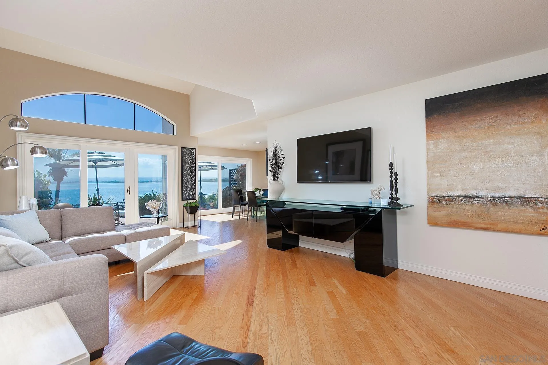 5 Aruba Bend Coronado, CA 92118 - Photo 7 of 40 a living room with furniture and a flat screen tv