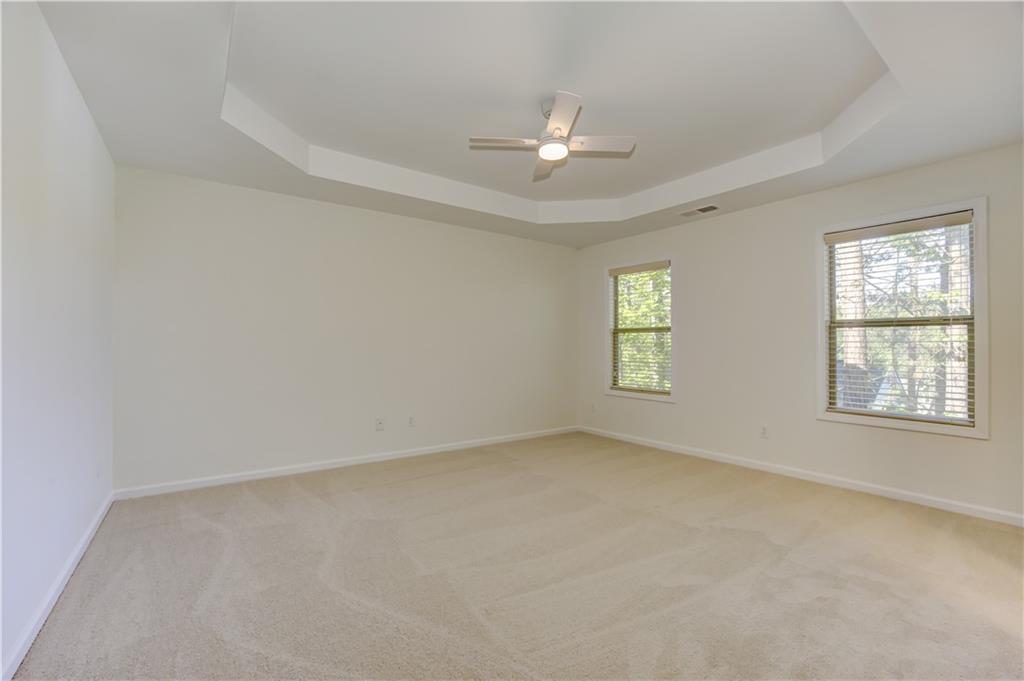 605 Summit Point Canton, GA 30114 - Photo 28 of 56 an empty room with windows and fan