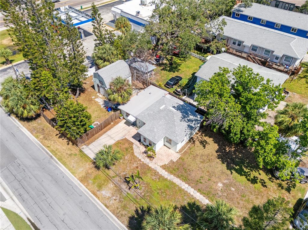 2600 1st Street Indian Rocks Beach, FL 33785 - Photo 33 of 40 an aerial view of a house with a yard and trees