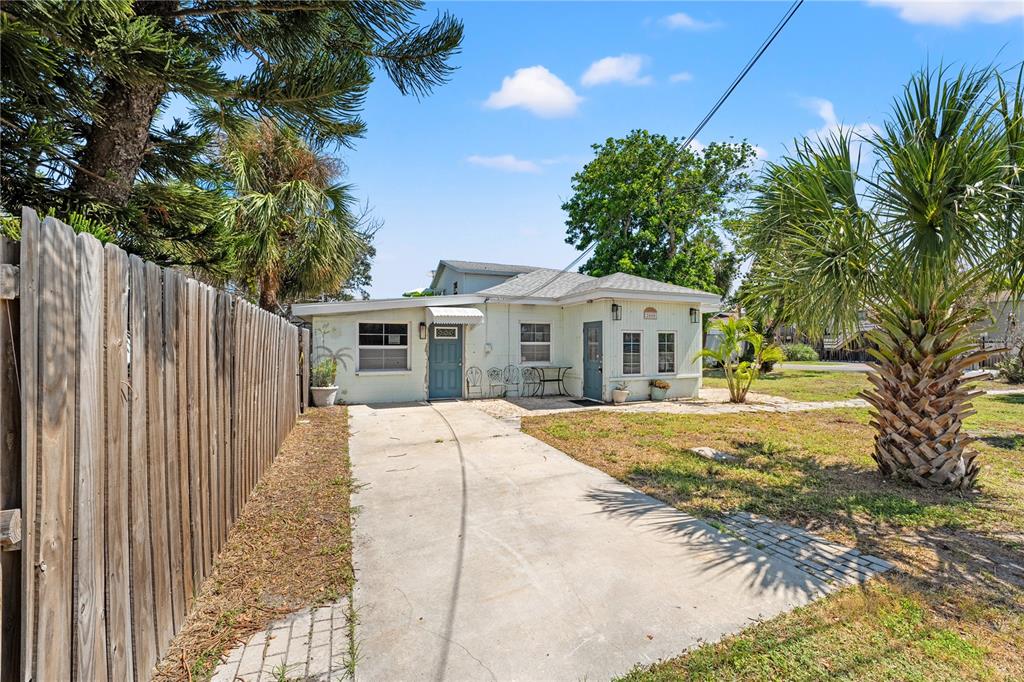 2600 1st Street Indian Rocks Beach, FL 33785 - Photo 35 of 40 a front view of a house with a garden