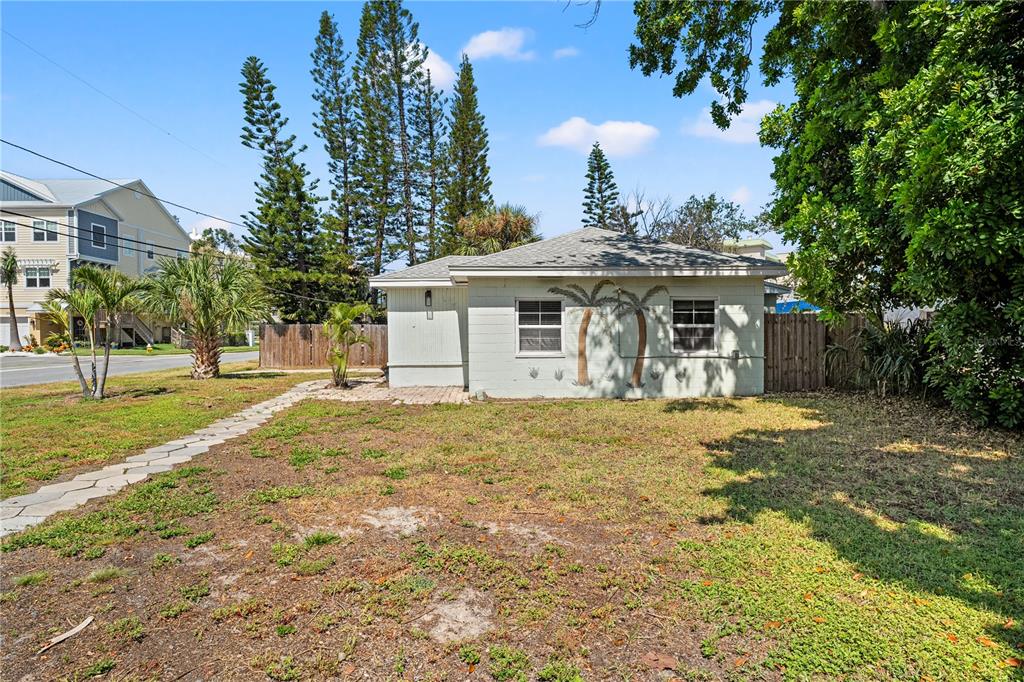 2600 1st Street Indian Rocks Beach, FL 33785 - Photo 38 of 40 a front view of a house with a yard