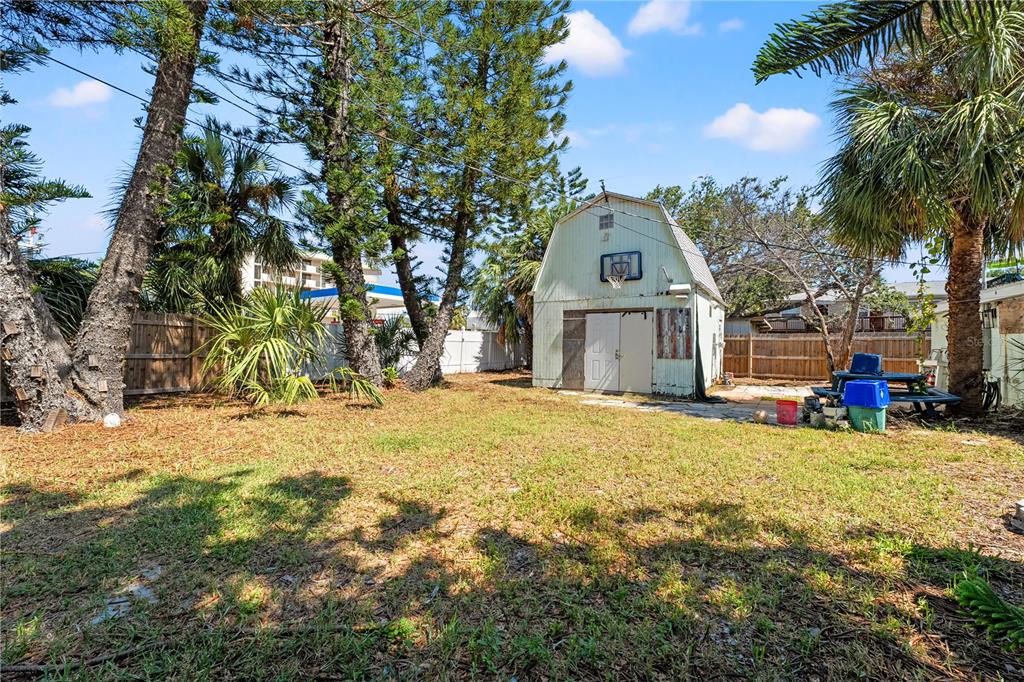 2600 1st Street Indian Rocks Beach, FL 33785 - Photo 39 of 40 a front view of a house with a yard and garage