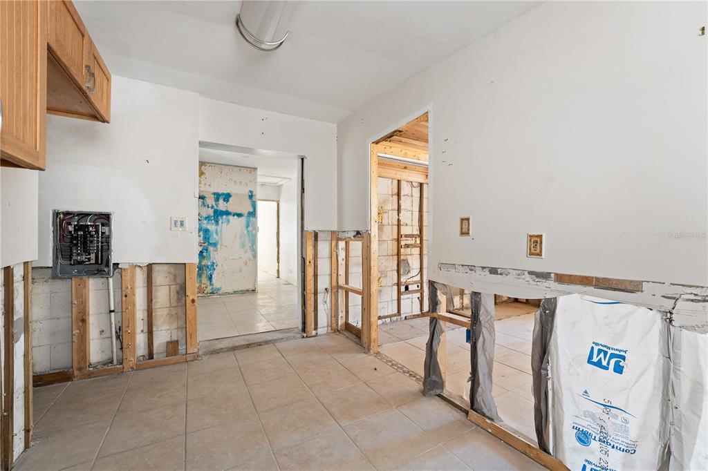 2600 1st Street Indian Rocks Beach, FL 33785 - Photo 9 of 40 a view of a livingroom with wooden furniture and windows