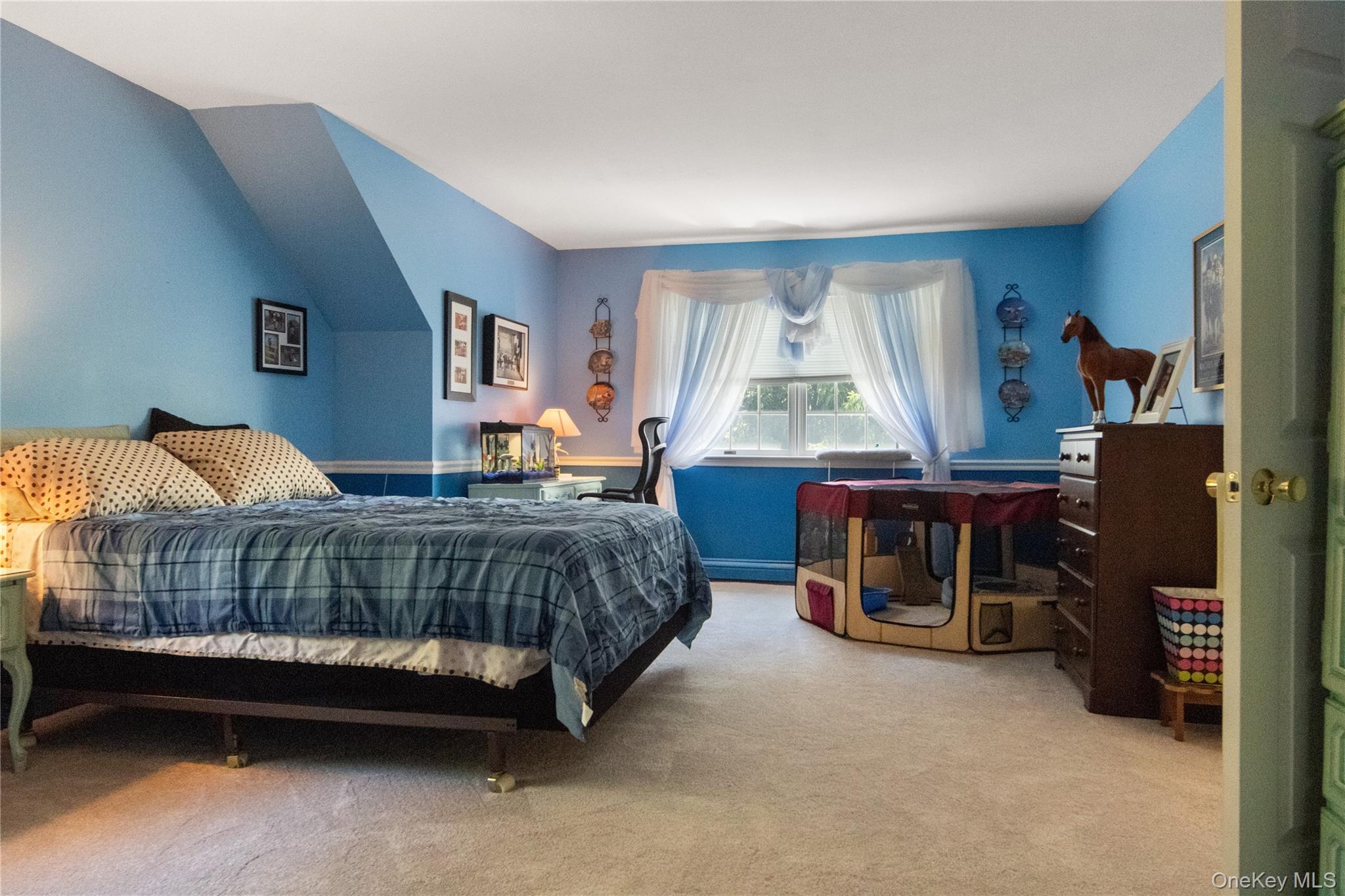 214 West Mombasha Road Monroe, NY 10950 - Photo 33 of 43 a bedroom with a bed and a large window in it