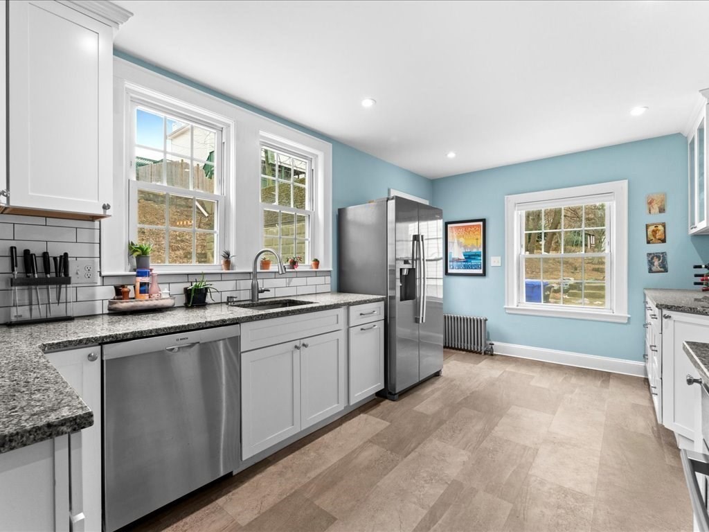 40 Lake Shore Road Boston, MA 02135 - Photo 1 of 39 a large kitchen with granite countertop a sink window and cabinets