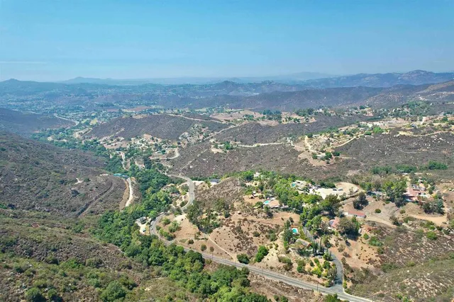 a view of a city with green space