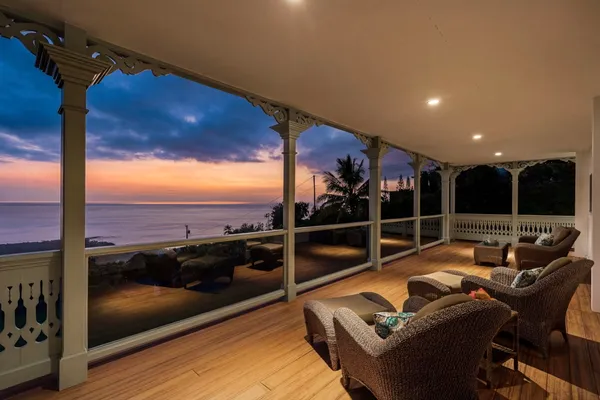 a view of a balcony with furniture and outside view