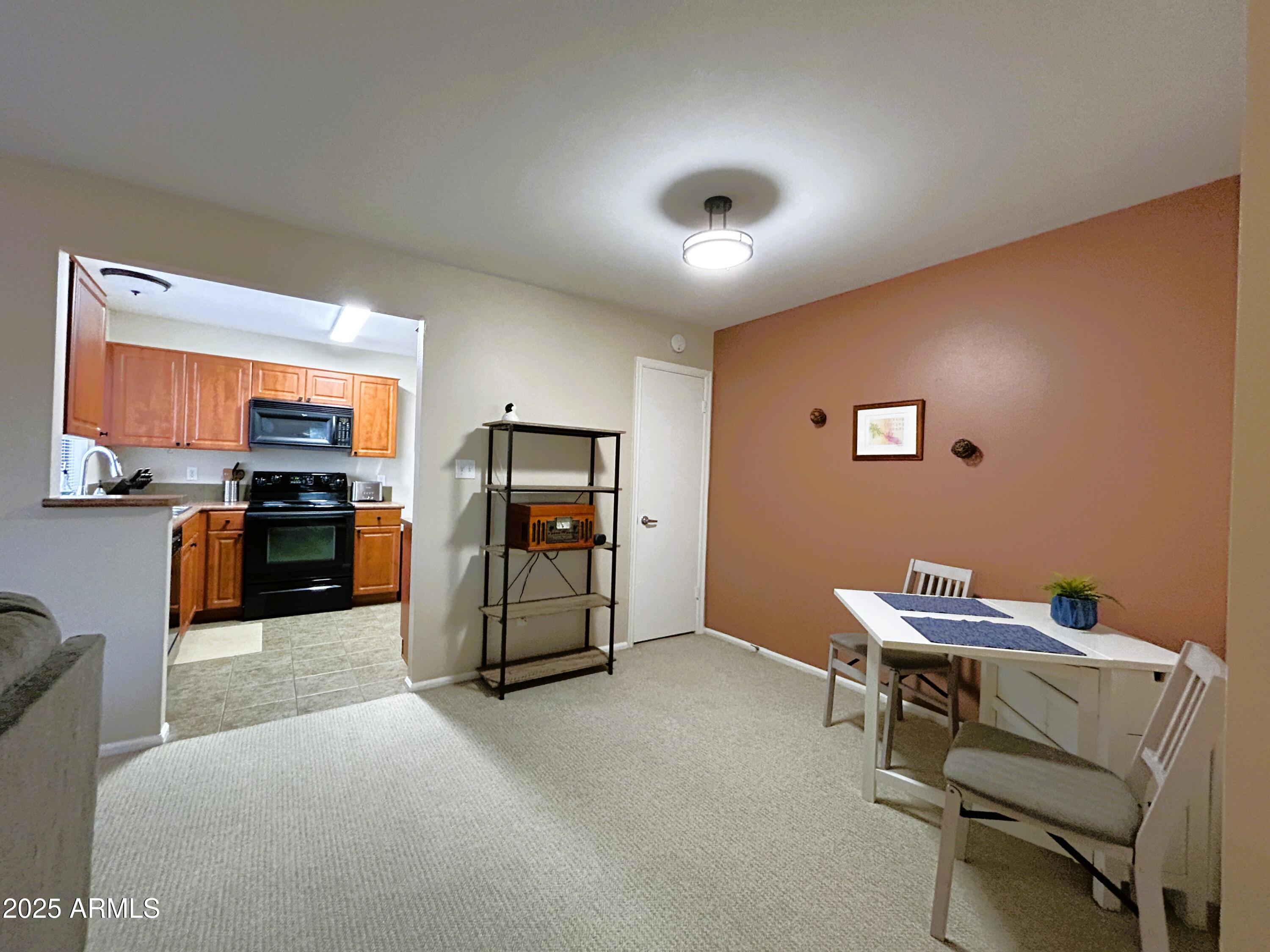 10055 East Mountainview Lake Drive, Unit 2059 Scottsdale, AZ 85258 - Photo 15 of 34 a living room with furniture and a flat screen tv