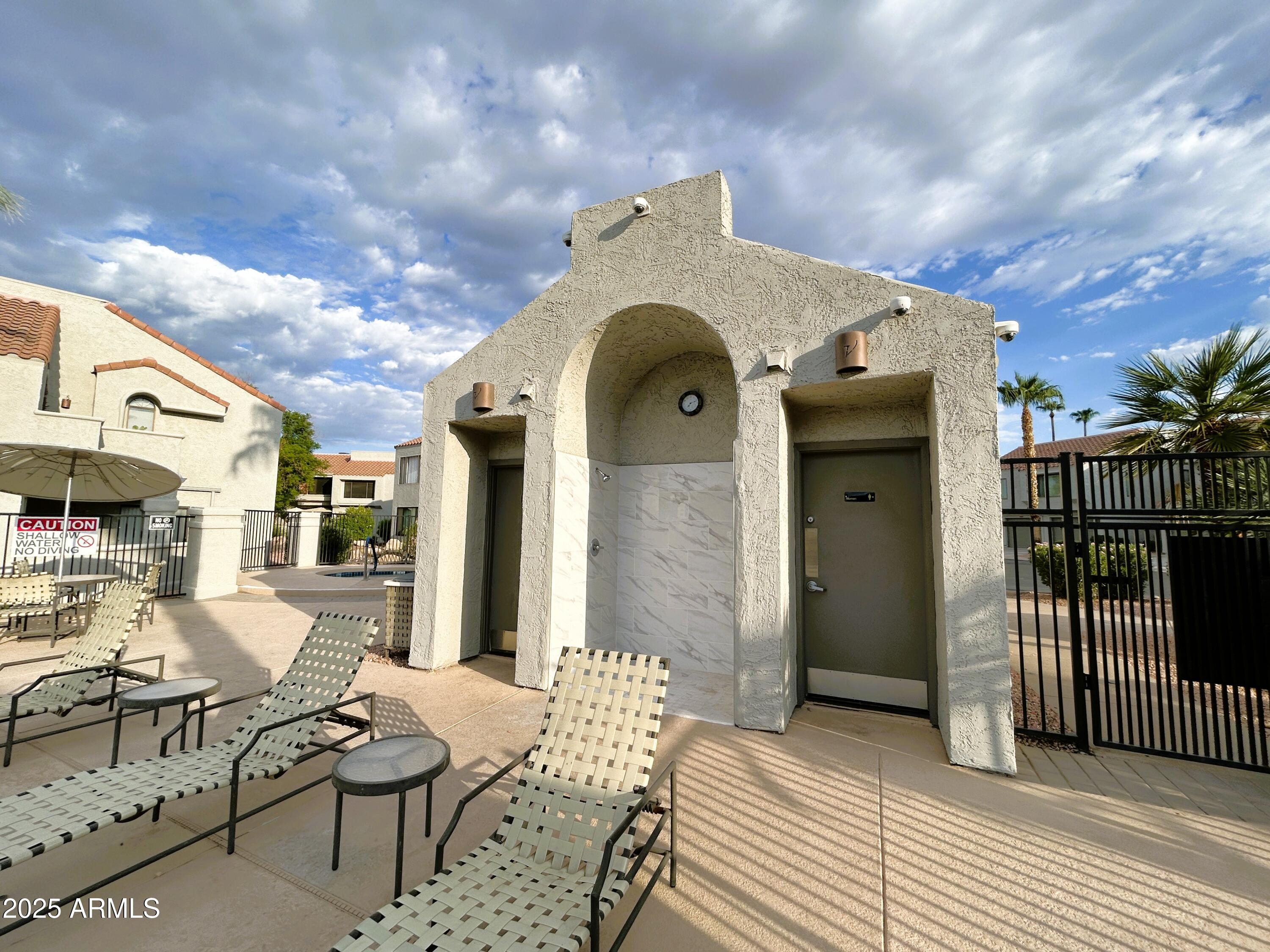 10055 East Mountainview Lake Drive, Unit 2059 Scottsdale, AZ 85258 - Photo 34 of 34 a view of a chairs and a table in a patio