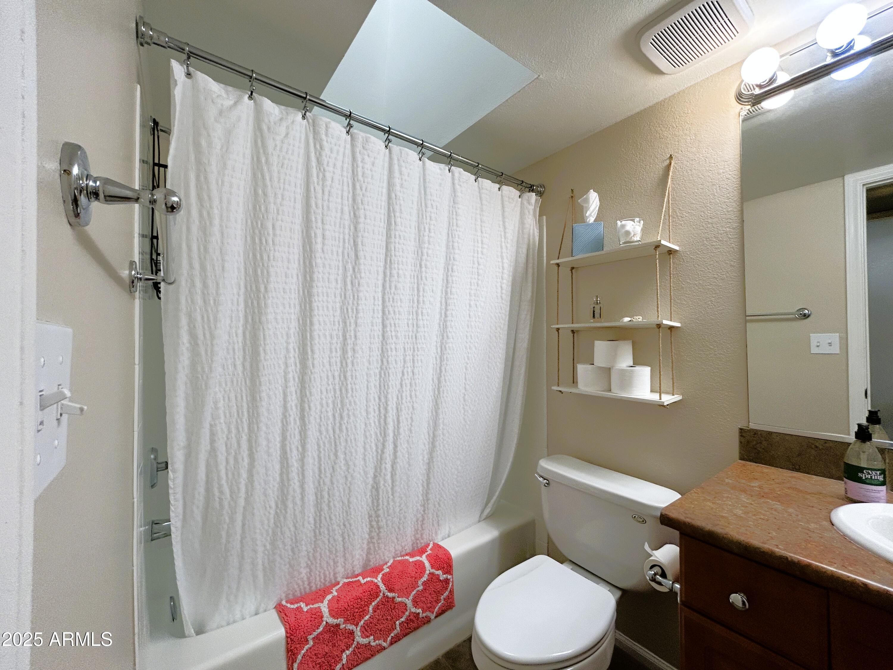 10055 East Mountainview Lake Drive, Unit 2059 Scottsdale, AZ 85258 - Photo 8 of 34 a bathroom with a granite countertop toilet sink and shower